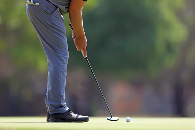 player putting on the green